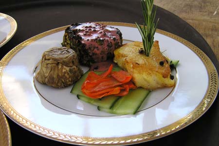 Surf and Turf of Filet Mignon with Pink Pepper Sauce and Truffle Risotto in Eggplant Shell and Infused Rosemary Sea Bass over a Bed of Cucumber and Confit Carrots