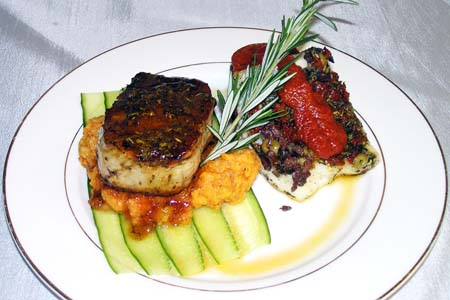 Pepper Filet Mignon Over a Bed of Root Mash Potatoes and Crusted Tapenade Sea Bass with Red Bell Pepper Coulis