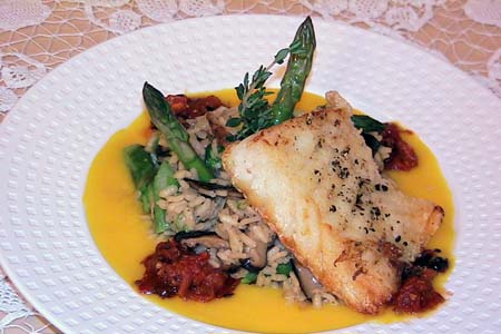 Grilled Sea Bass over A Truffle Risotto and Bouillabaisse Sauce